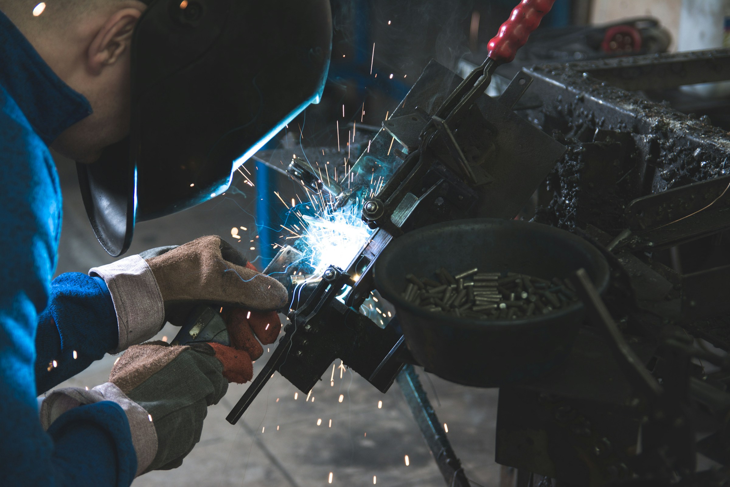 Metal welding in an industrial manufacturing environment